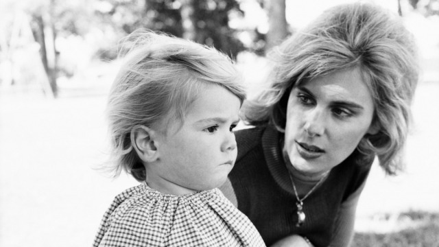 Black and white image of a mother and young daughter