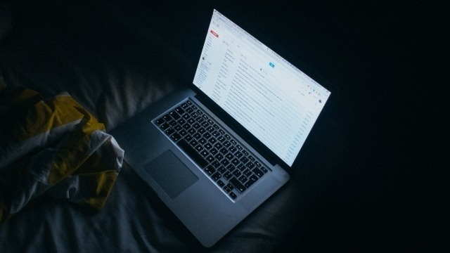 After Christchurch: Violent Extremism Online Laptop open in a dark room